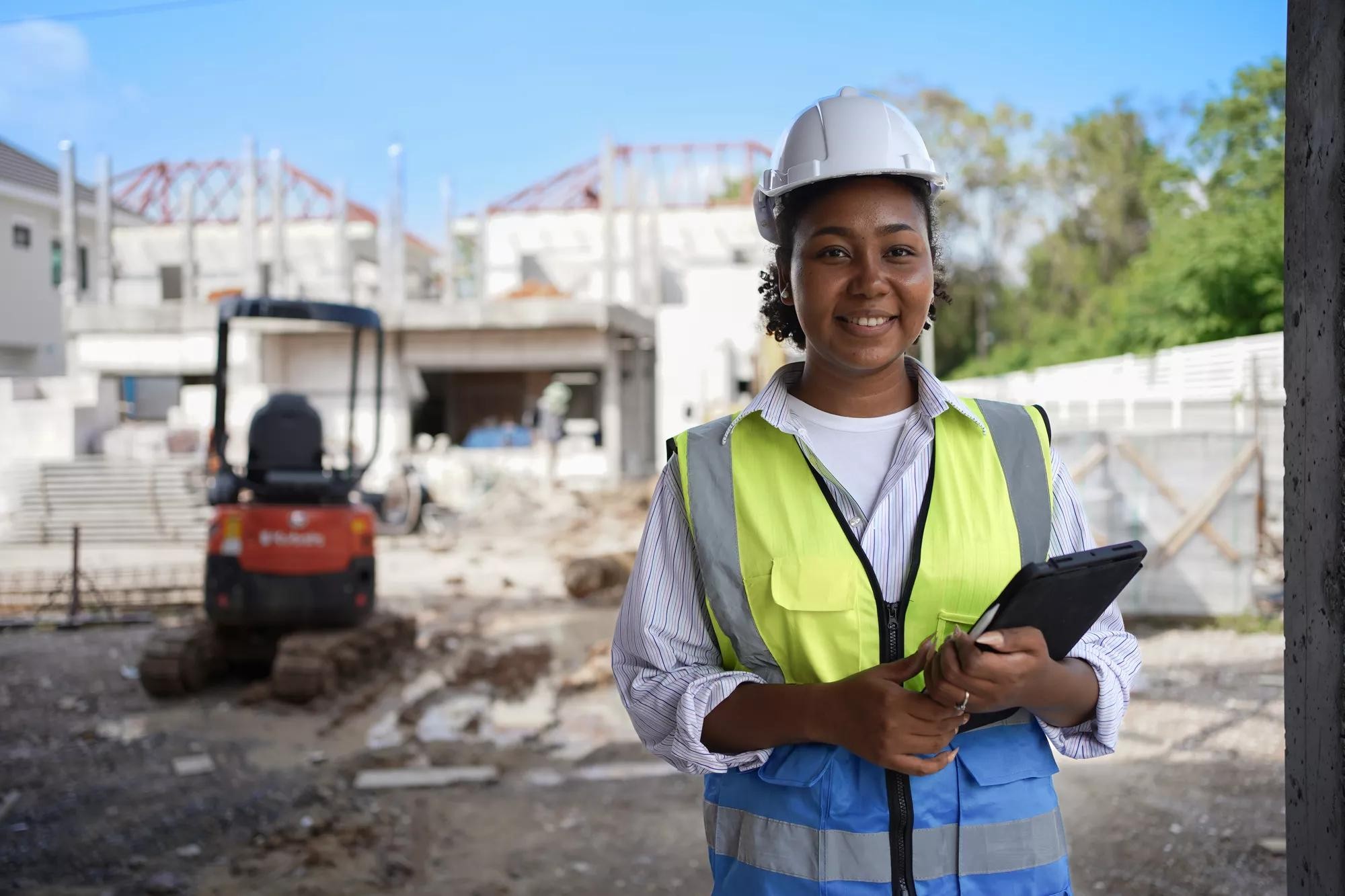 Woman worker engineer as project manager in construction site. Leadership of African American female.