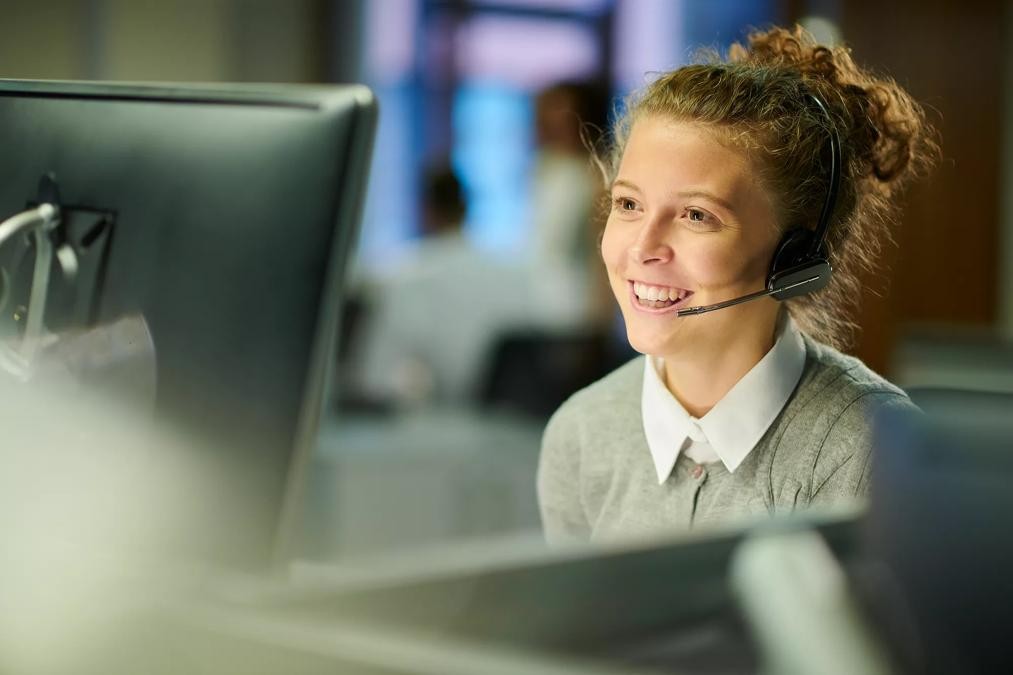 a female call centre worker at her terminal